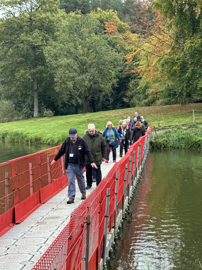 Picture of the u3a members crossing a pontoon bridge erected as the beautiful listed Chinese Bridge is unsafe.